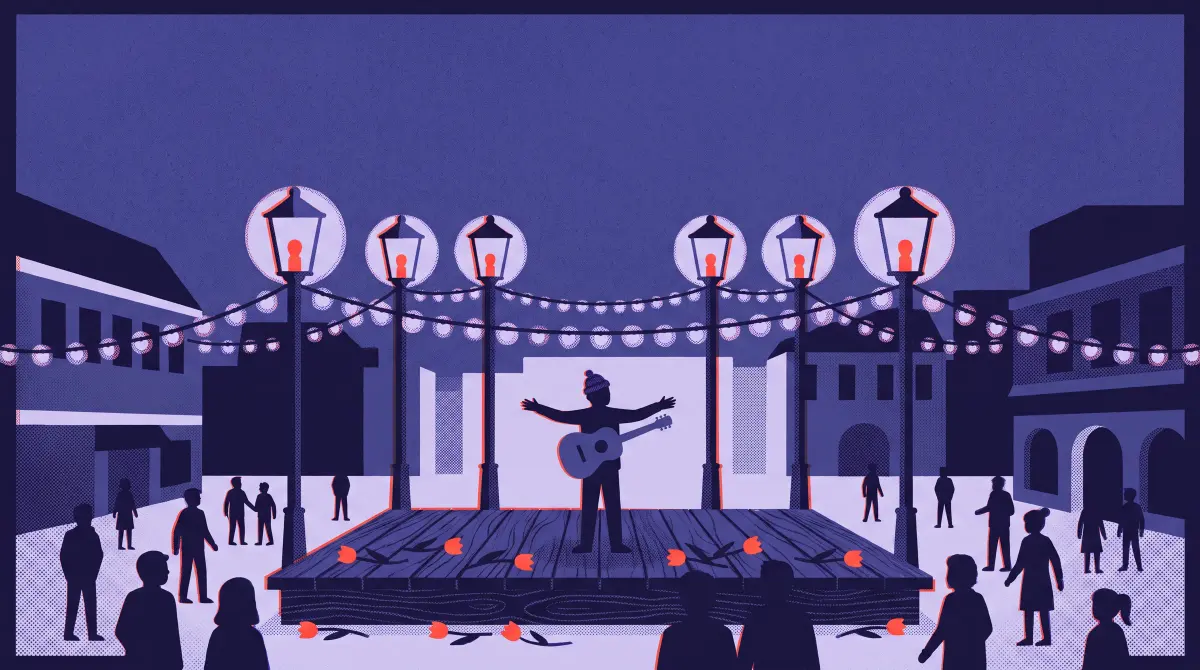 A town square at night: six street lamps light a raised wooden platform, a performer with arms open, a crowd of silhouettes.